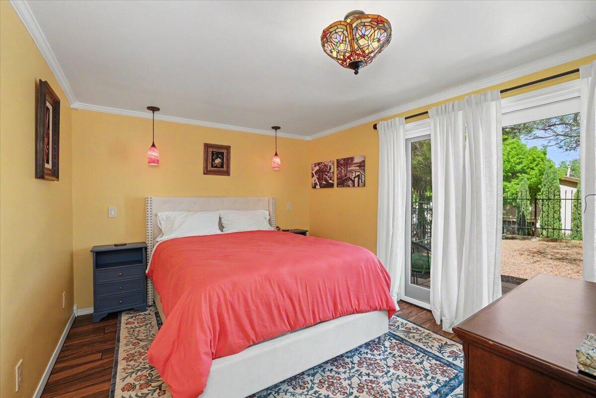 5 West Lakeshore Drive Ransom Canyon, TX 79366 - Photo 23 of 61 a bedroom with a bed and a table