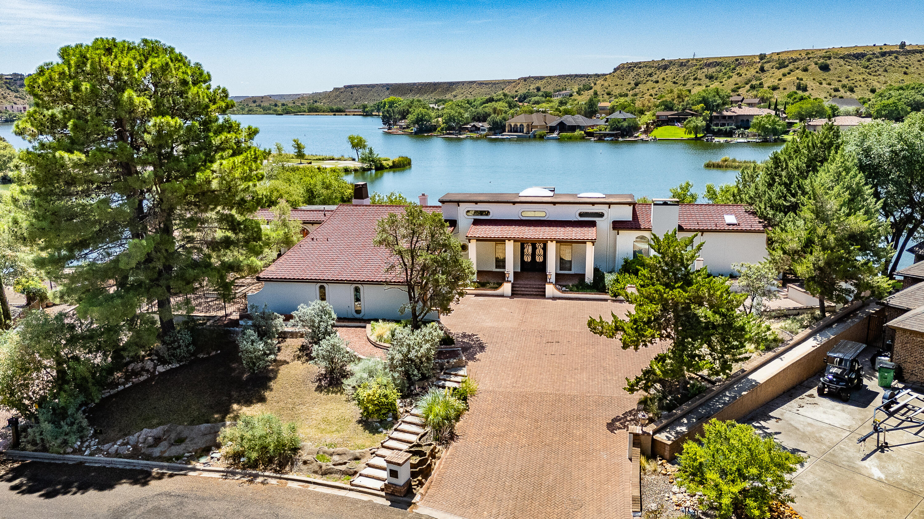 5 West Lakeshore Drive Ransom Canyon, TX 79366 - Photo 3 of 61 an aerial view of a house with a garden and lake view