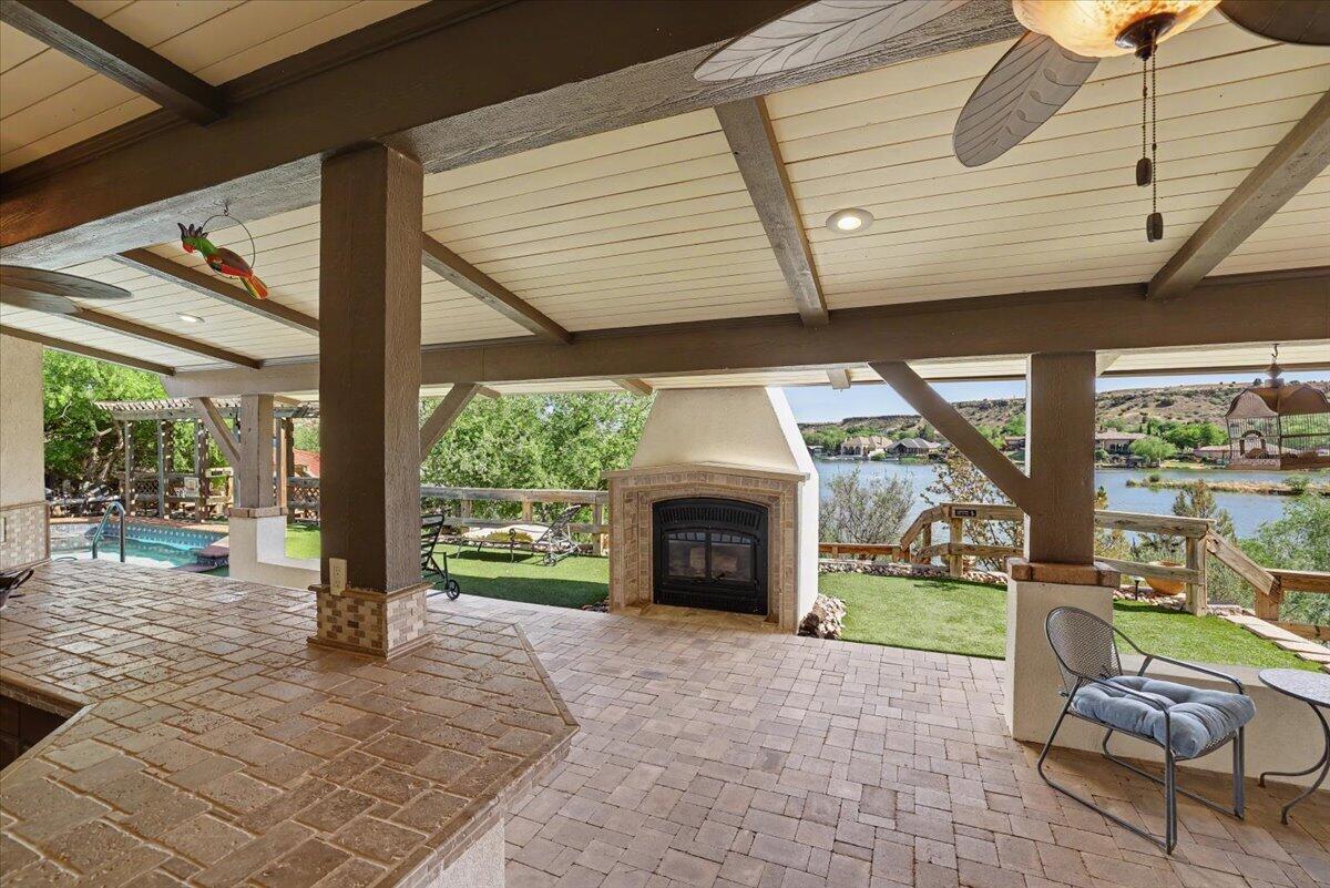 5 West Lakeshore Drive Ransom Canyon, TX 79366 - Photo 36 of 61 a view of a porch with chairs and a floor to ceiling window and wooden fence