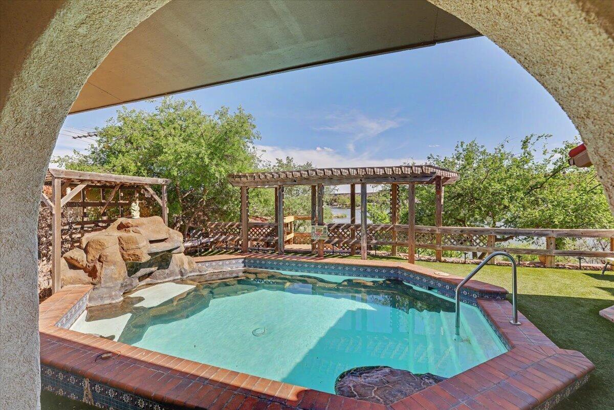 5 West Lakeshore Drive Ransom Canyon, TX 79366 - Photo 42 of 61 a view of a swimming pool with a patio