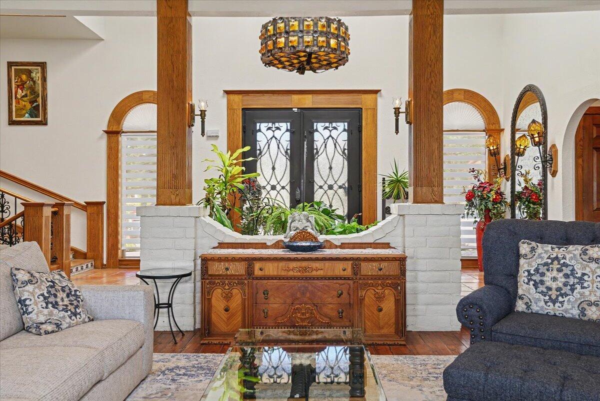 5 West Lakeshore Drive Ransom Canyon, TX 79366 - Photo 6 of 61 a living room with furniture a fireplace and potted plants