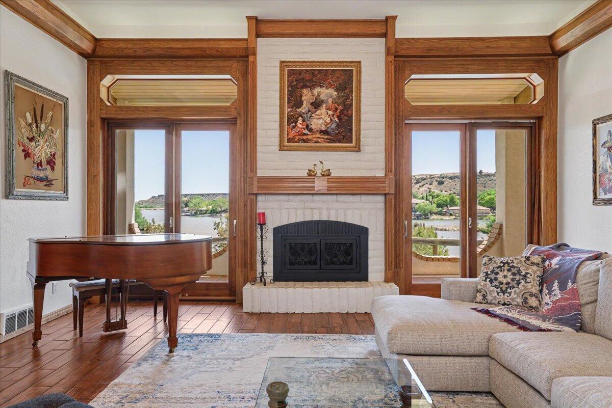 5 West Lakeshore Drive Ransom Canyon, TX 79366 - Photo 8 of 61 a living room with furniture a window and a fireplace