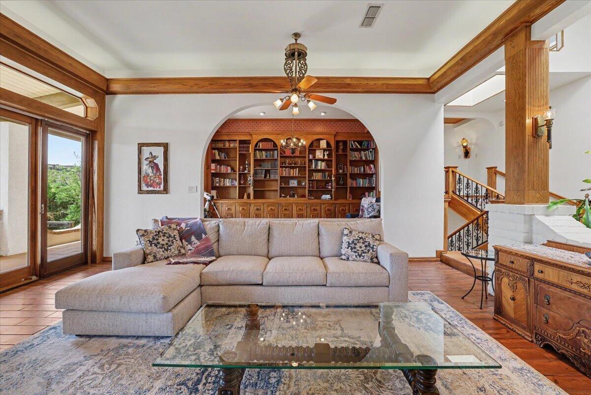5 West Lakeshore Drive Ransom Canyon, TX 79366 - Photo 10 of 61 a living room with furniture and a chandelier