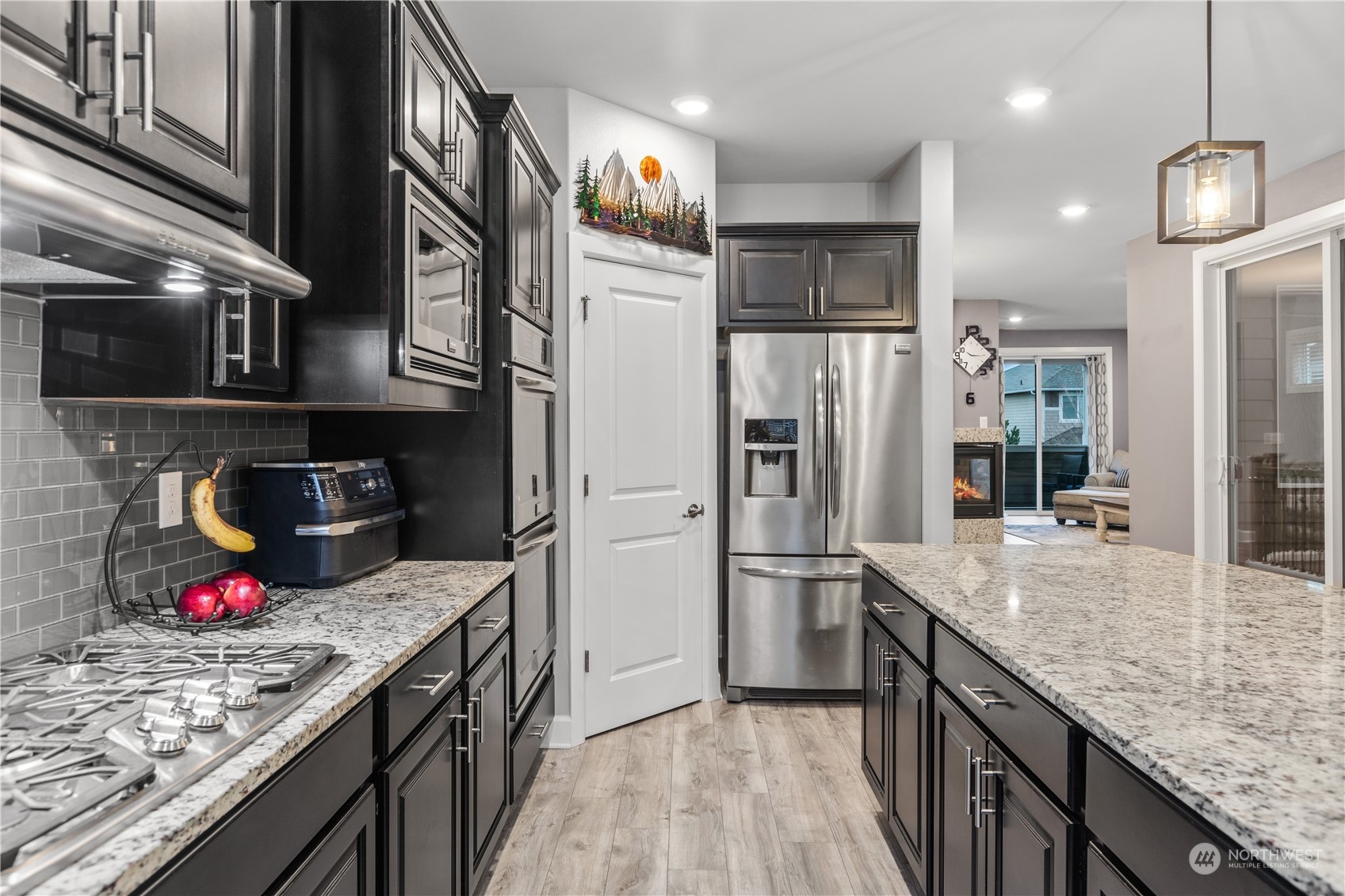 17517 40th Drive Southeast Bothell, WA 98012 - Photo 13 of 40 a kitchen with stainless steel appliances granite countertop a sink refrigerator and cabinets