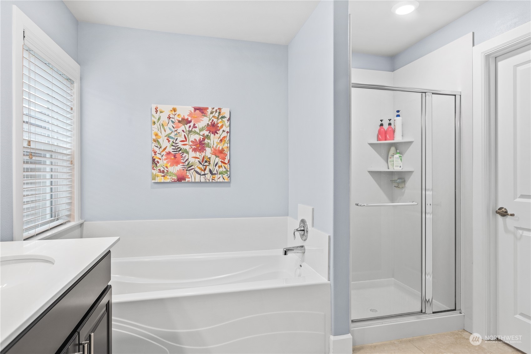 17517 40th Drive Southeast Bothell, WA 98012 - Photo 25 of 40 a bathroom with a bathtub and a shower
