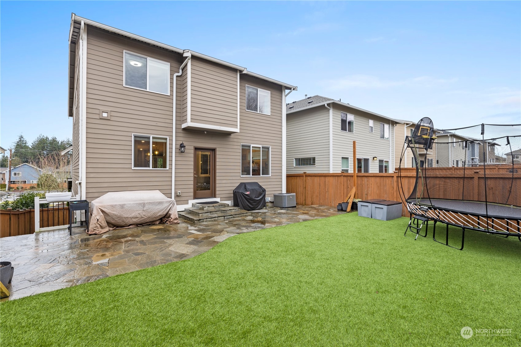17517 40th Drive Southeast Bothell, WA 98012 - Photo 36 of 40 a backyard of a house with table and chairs