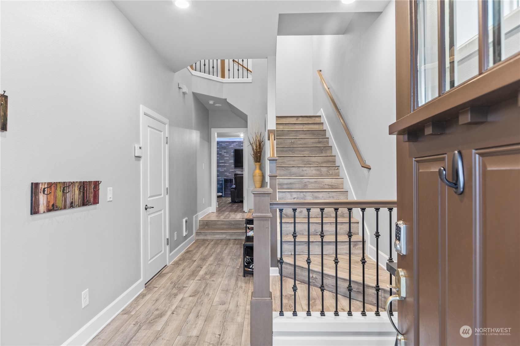 17517 40th Drive Southeast Bothell, WA 98012 - Photo 4 of 40 a view of a hallway with wooden floor and stairs
