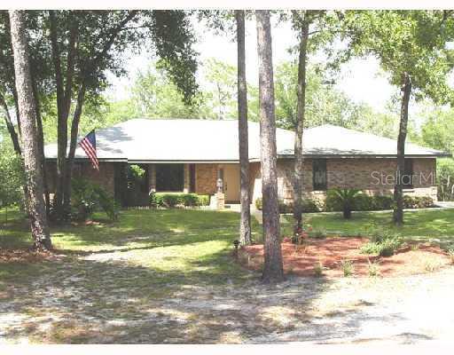 1515 Rockingham Lane DeLand, FL 32724 - Photo 1 of 1 a view of backyard with green space