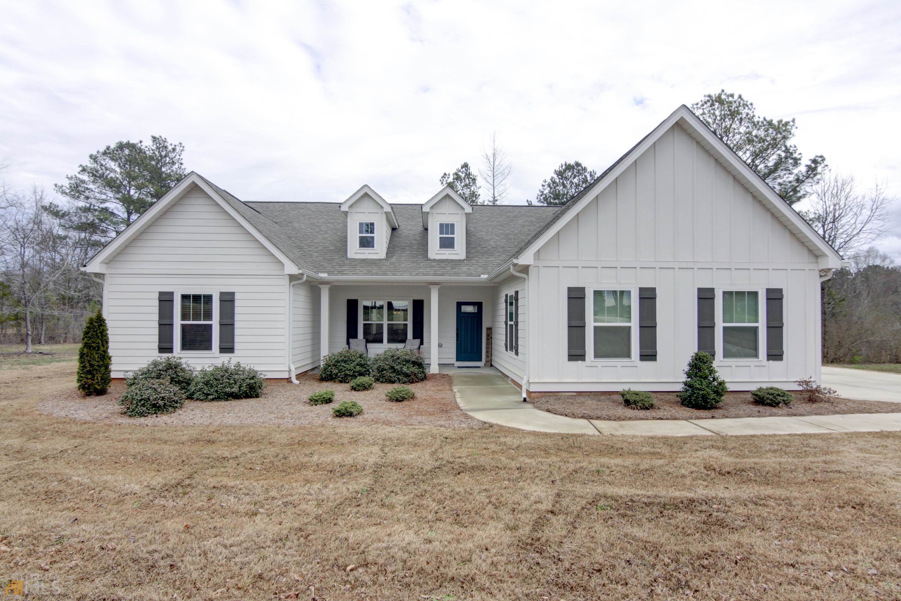 701 Fairview Road Brooks, GA 30205 - Photo 1 of 1 a front view of a house with garden