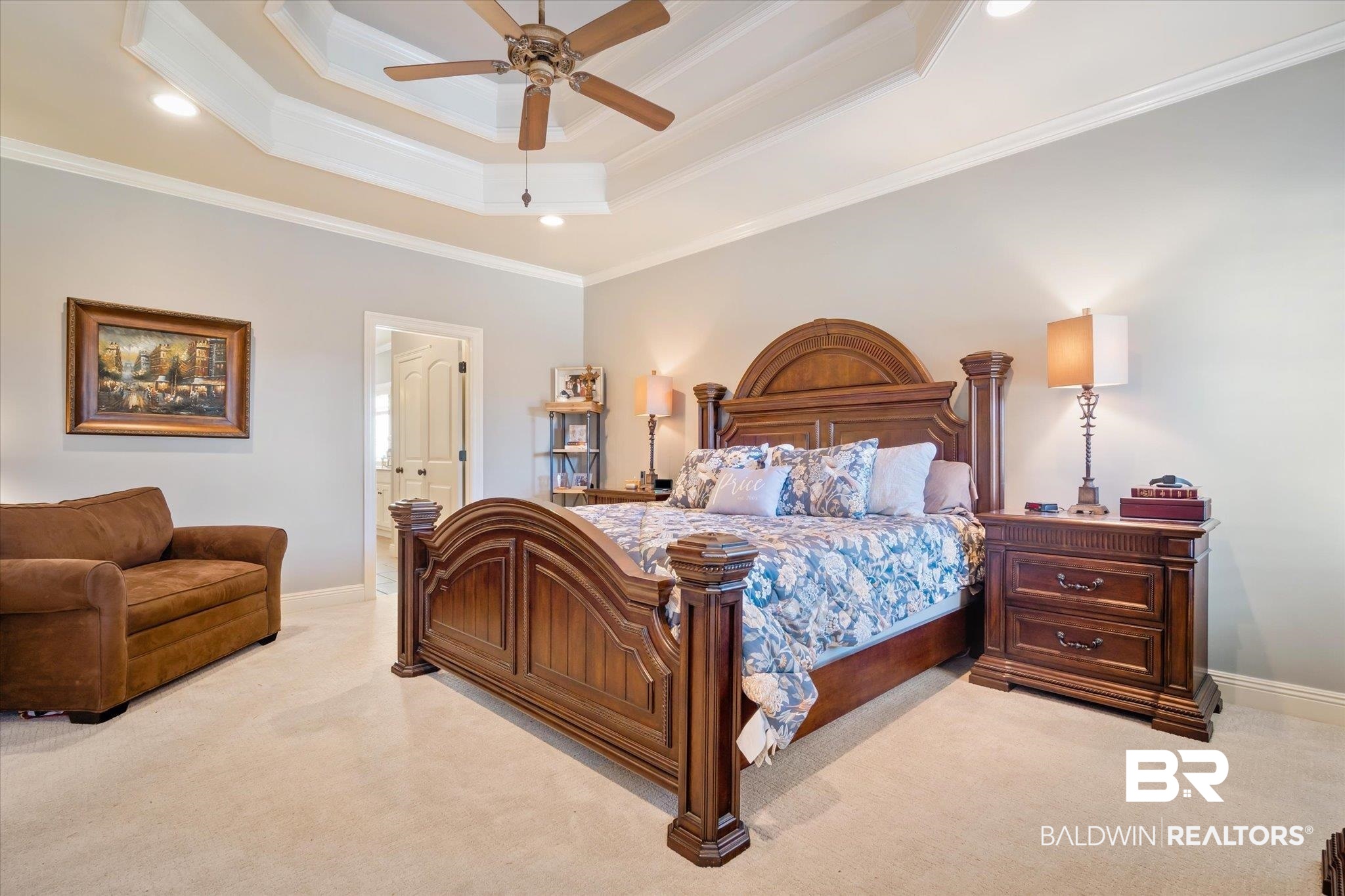 5683 Spring Landing Drive Theodore, AL 36582 - Photo 15 of 49 Carpeted bedroom featuring ceiling fan, ornamental molding, ensuite bathroom, and a tray ceiling