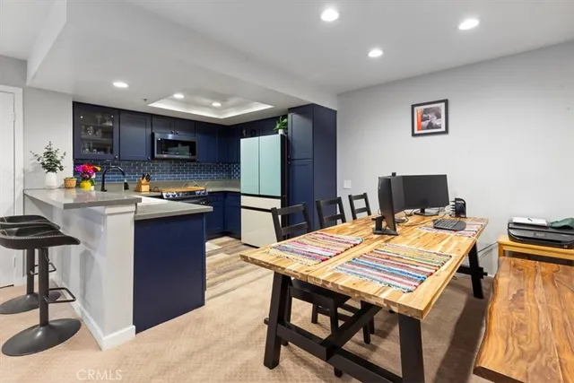 a kitchen with a table and chairs in it