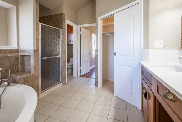 a kitchen with a refrigerator and a sink