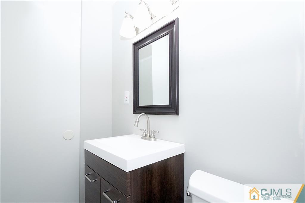 9 Brookside Road Edison, NJ 08817 - Photo 16 of 24 a bathroom with a sink toilet and mirror