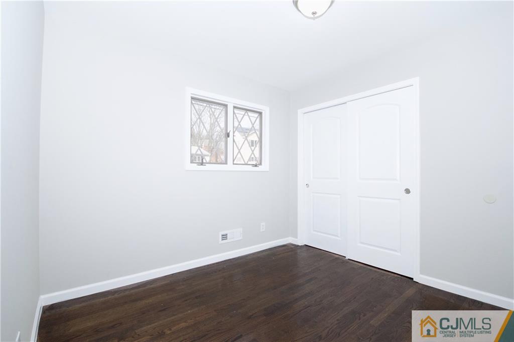 9 Brookside Road Edison, NJ 08817 - Photo 17 of 24 a view of a room with wooden floor and windows