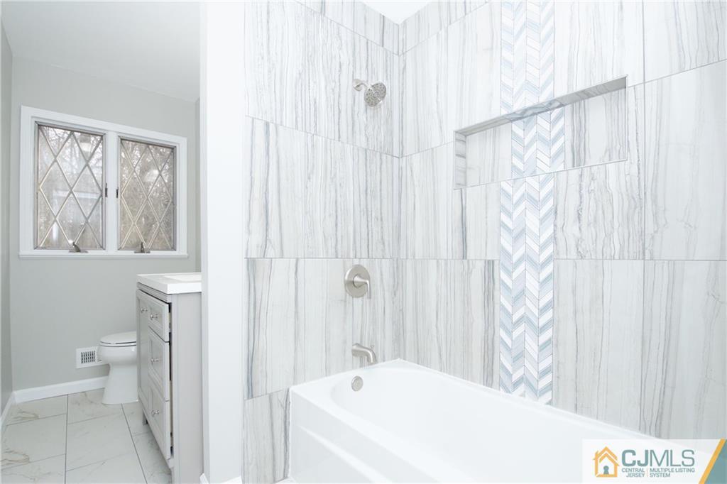 9 Brookside Road Edison, NJ 08817 - Photo 21 of 24 a bathroom with a sink and a toilet