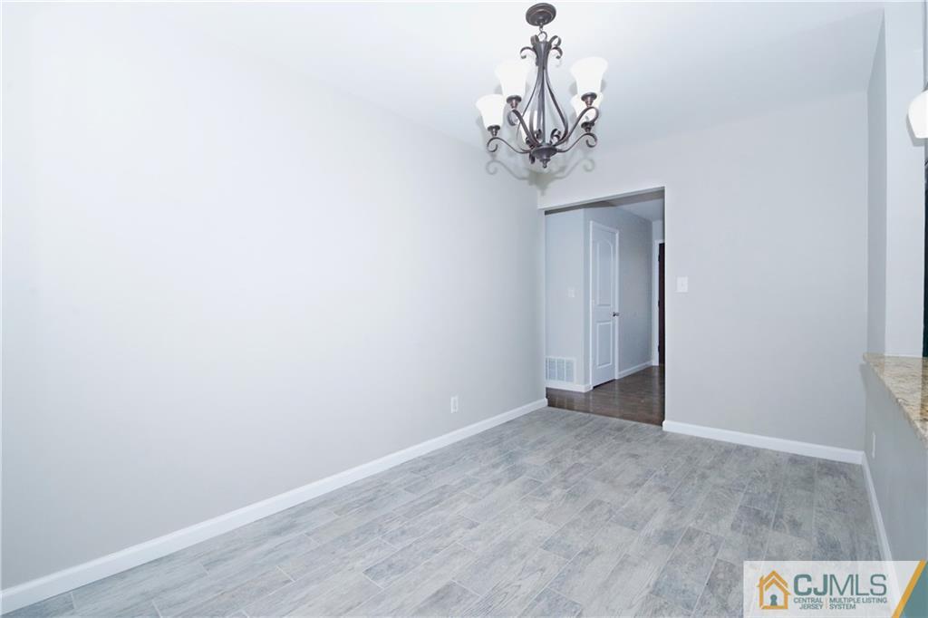9 Brookside Road Edison, NJ 08817 - Photo 9 of 24 a view of a chandelier in a room