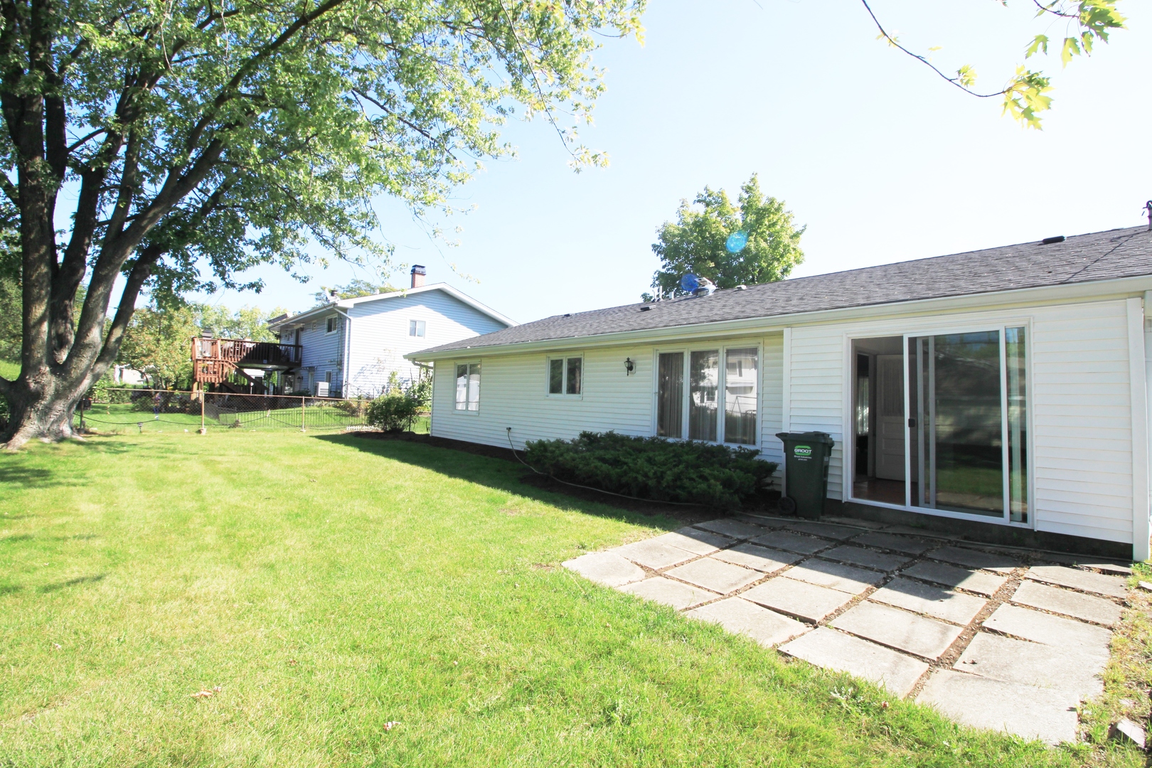 1370 Hassell Road Hoffman Estates, IL 60169 - Photo 17 of 17 a front view of a house with garden