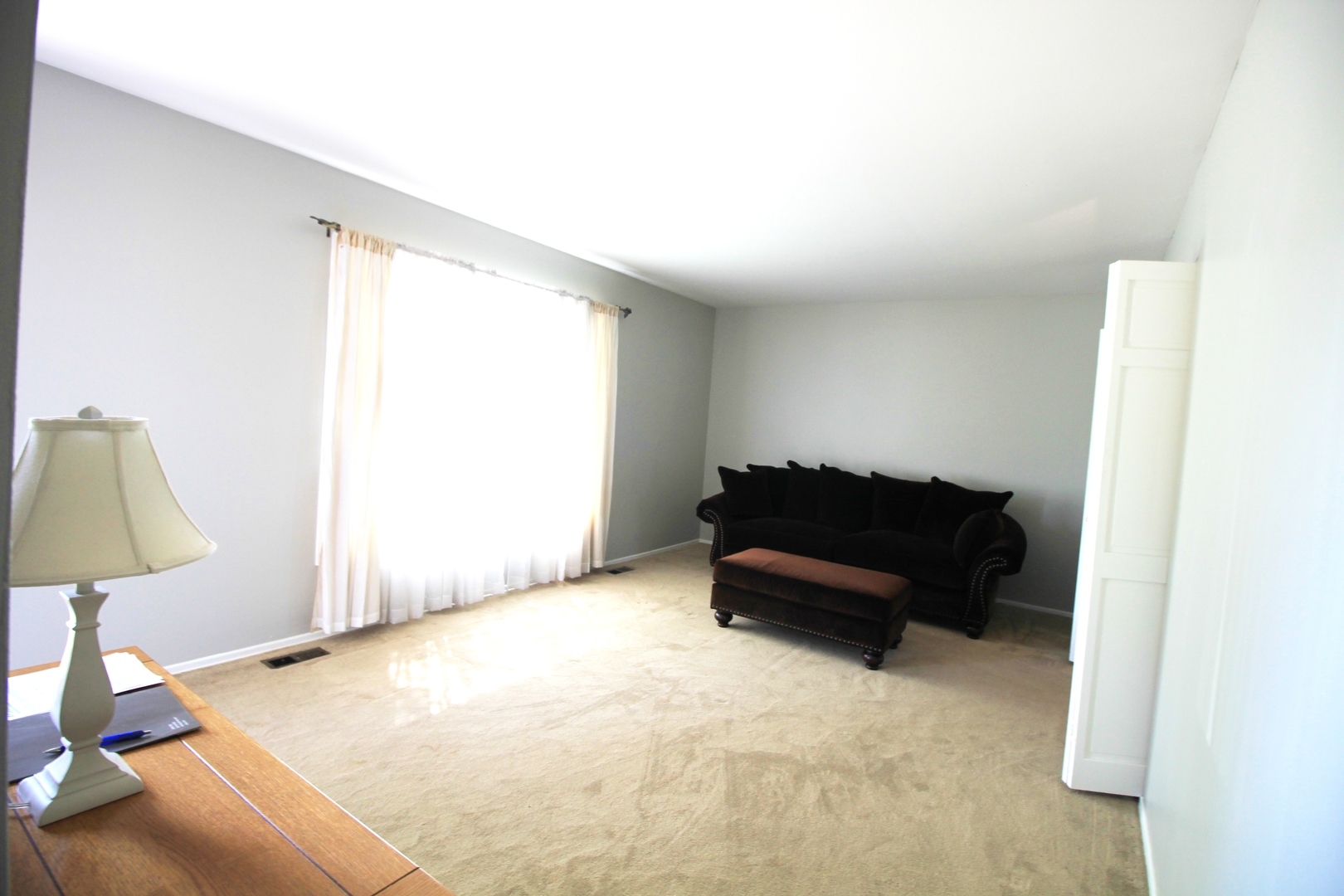 1370 Hassell Road Hoffman Estates, IL 60169 - Photo 3 of 17 a living room with furniture and a window