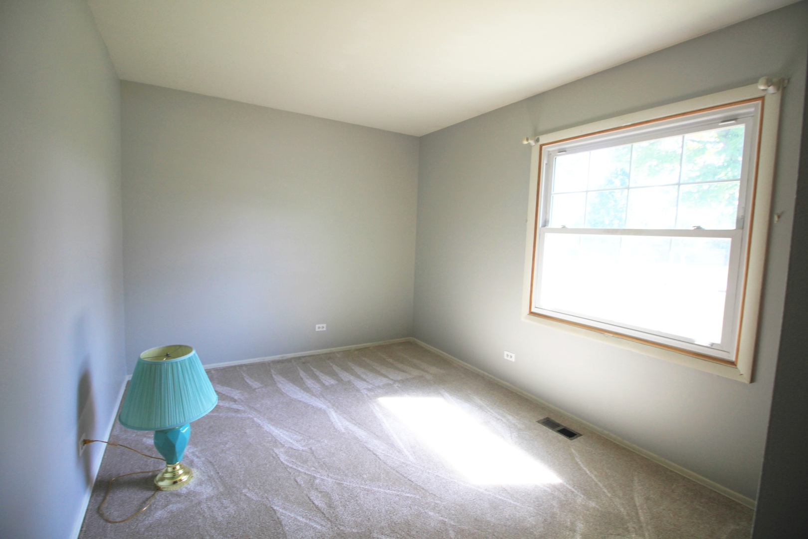 1370 Hassell Road Hoffman Estates, IL 60169 - Photo 9 of 17 a view of an empty room and window