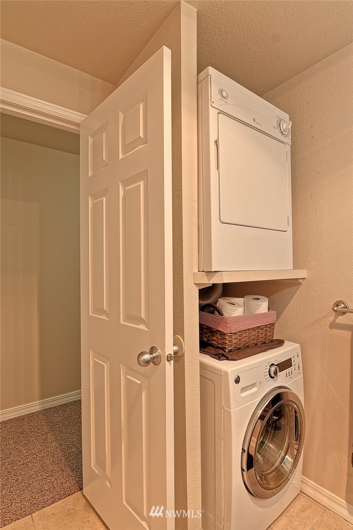 20330 Bothell Everett Highway, Unit C204 Bothell, WA 98012 - Photo 13 of 24 a utility room with dryer and washer