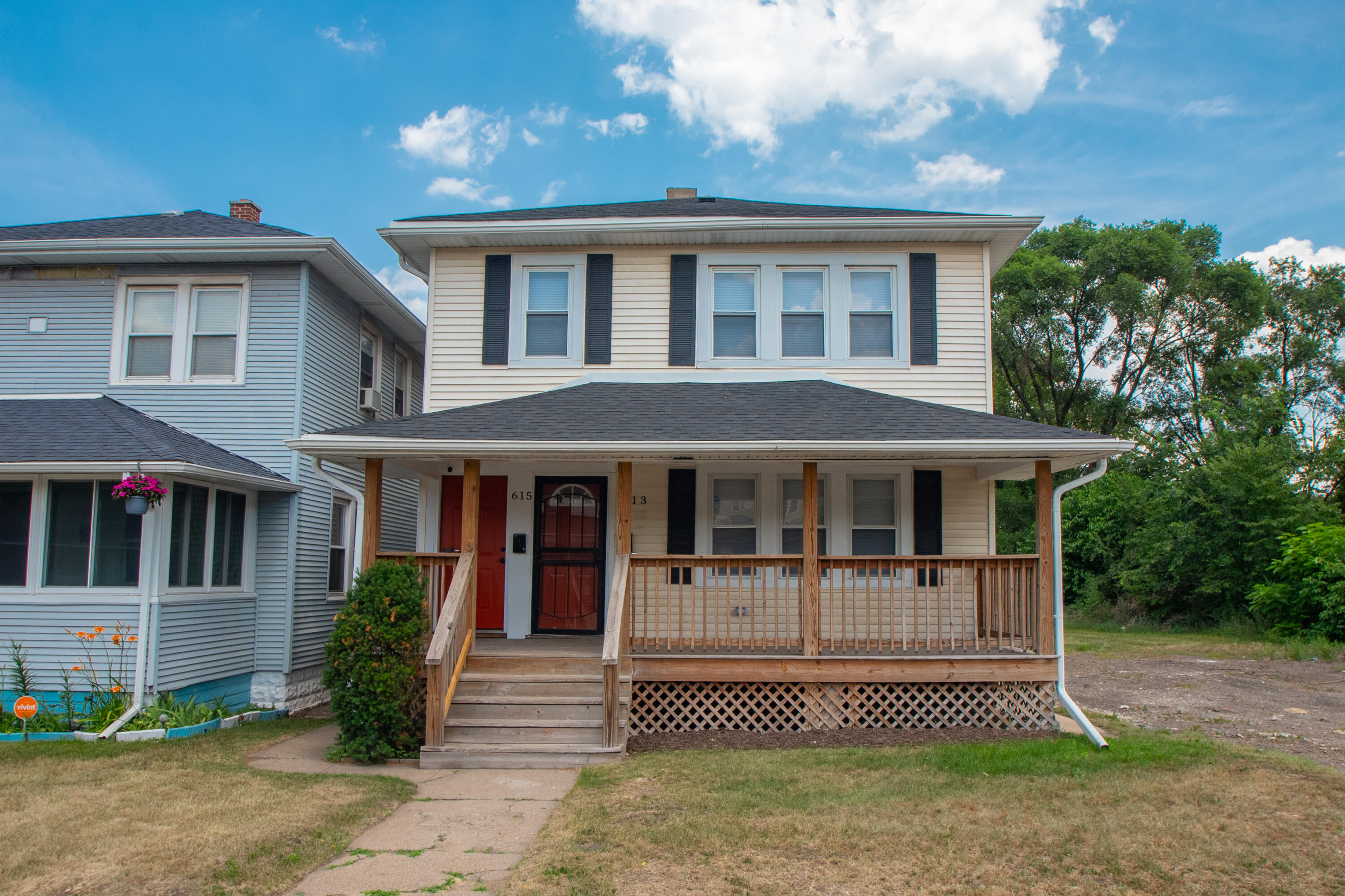 613 Tennessee Street Gary, IN 46402 - Photo 1 of 39 a front view of a house with a yard