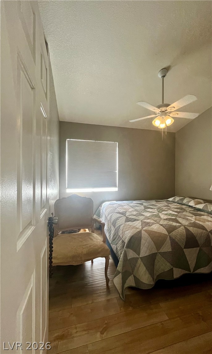 15 Rue Des Champs Henderson, NV 89074 - Photo 12 of 23 Gleaming hardwood floors and a classic window setup define this quiet bedroom retreat.