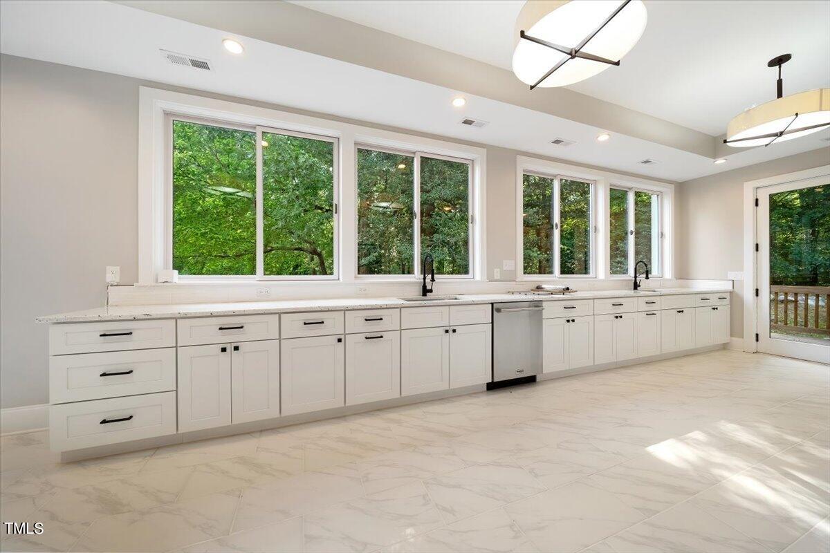 6300 Swallow Cove Lane Raleigh, NC 27614 - Photo 18 of 67 a large white cabinet with white cabinets