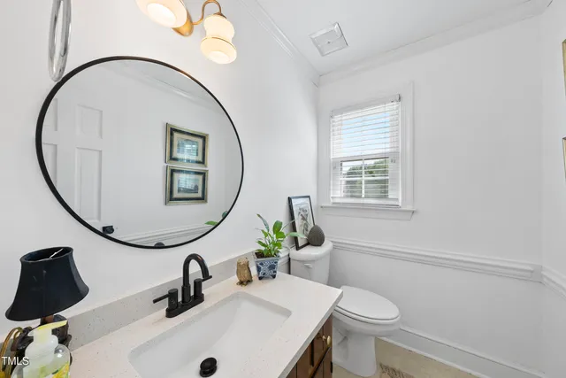 a kitchen with granite countertop white cabinets and stainless steel appliances