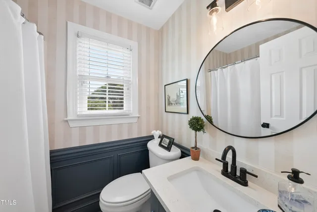 a bedroom with a bed and dresser