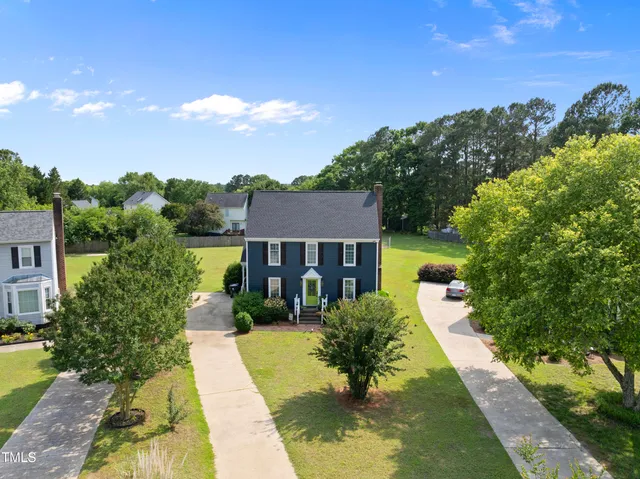 an aerial view of a house with a garden