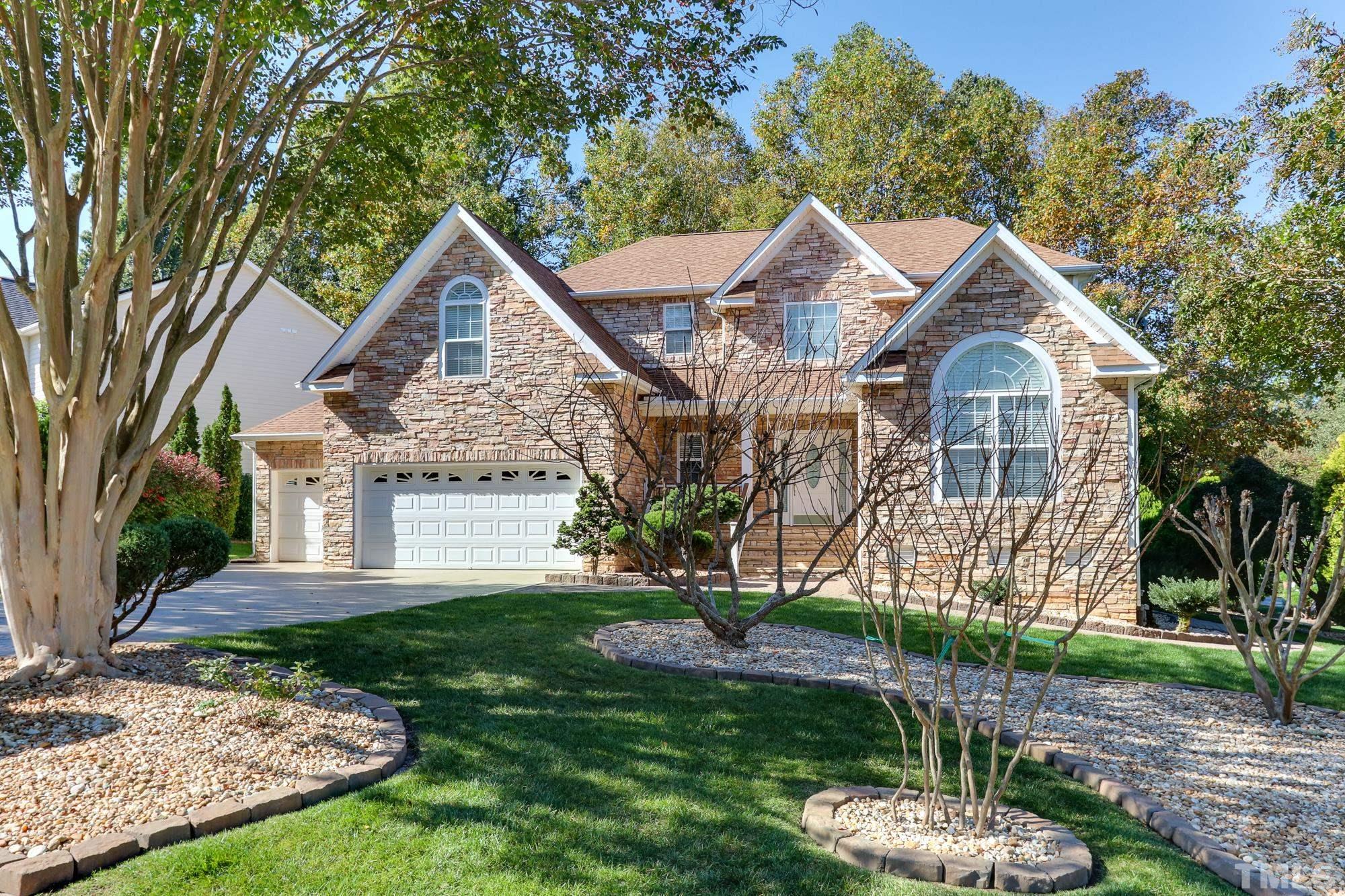 100 Mickleson Ridge Drive Raleigh, NC 27603 - Photo 1 of 59 a front view of a house with a yard