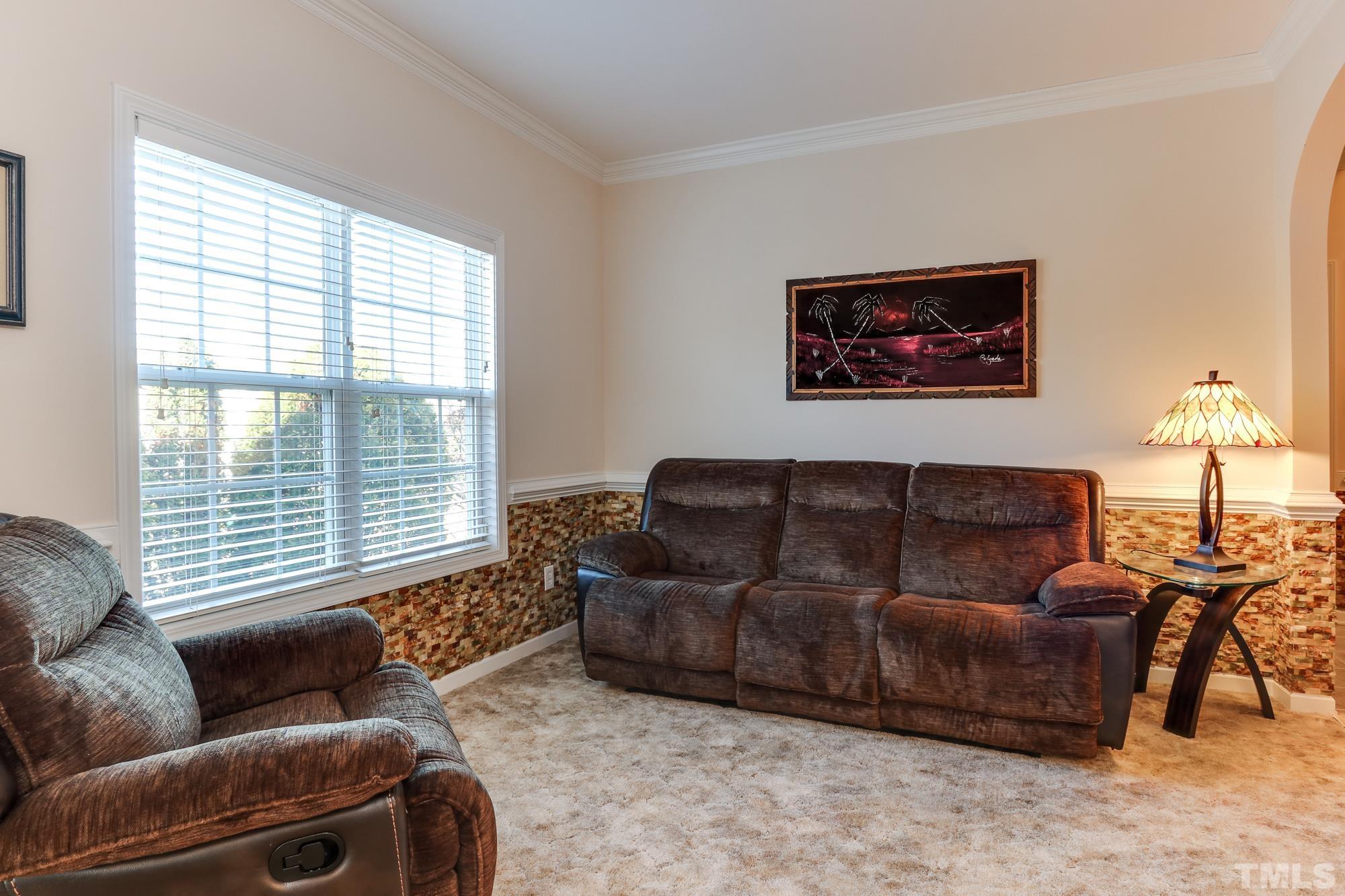 100 Mickleson Ridge Drive Raleigh, NC 27603 - Photo 20 of 59 a living room with furniture and a window