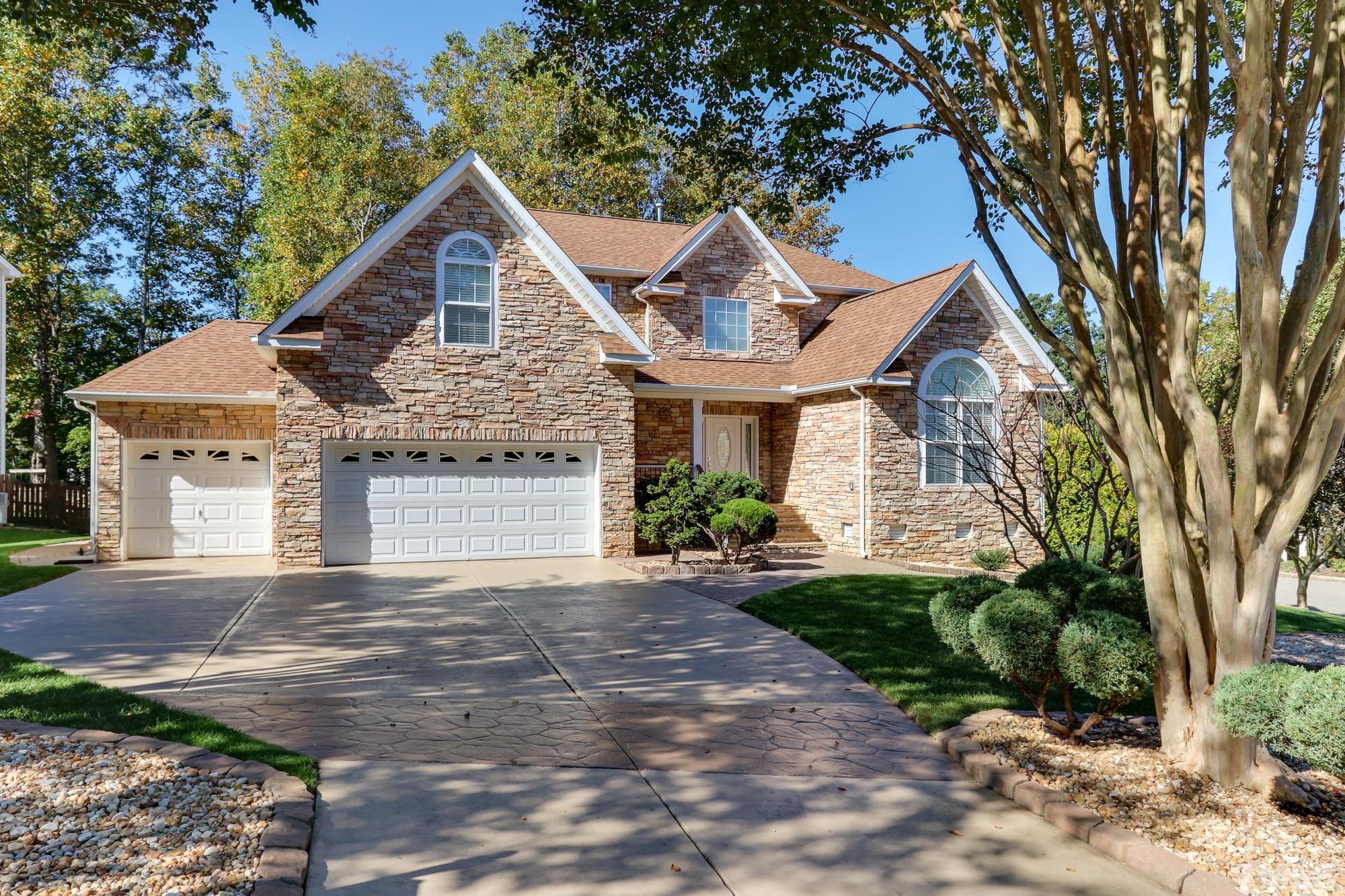 100 Mickleson Ridge Drive Raleigh, NC 27603 - Photo 2 of 59 a front view of a house with a yard and garage