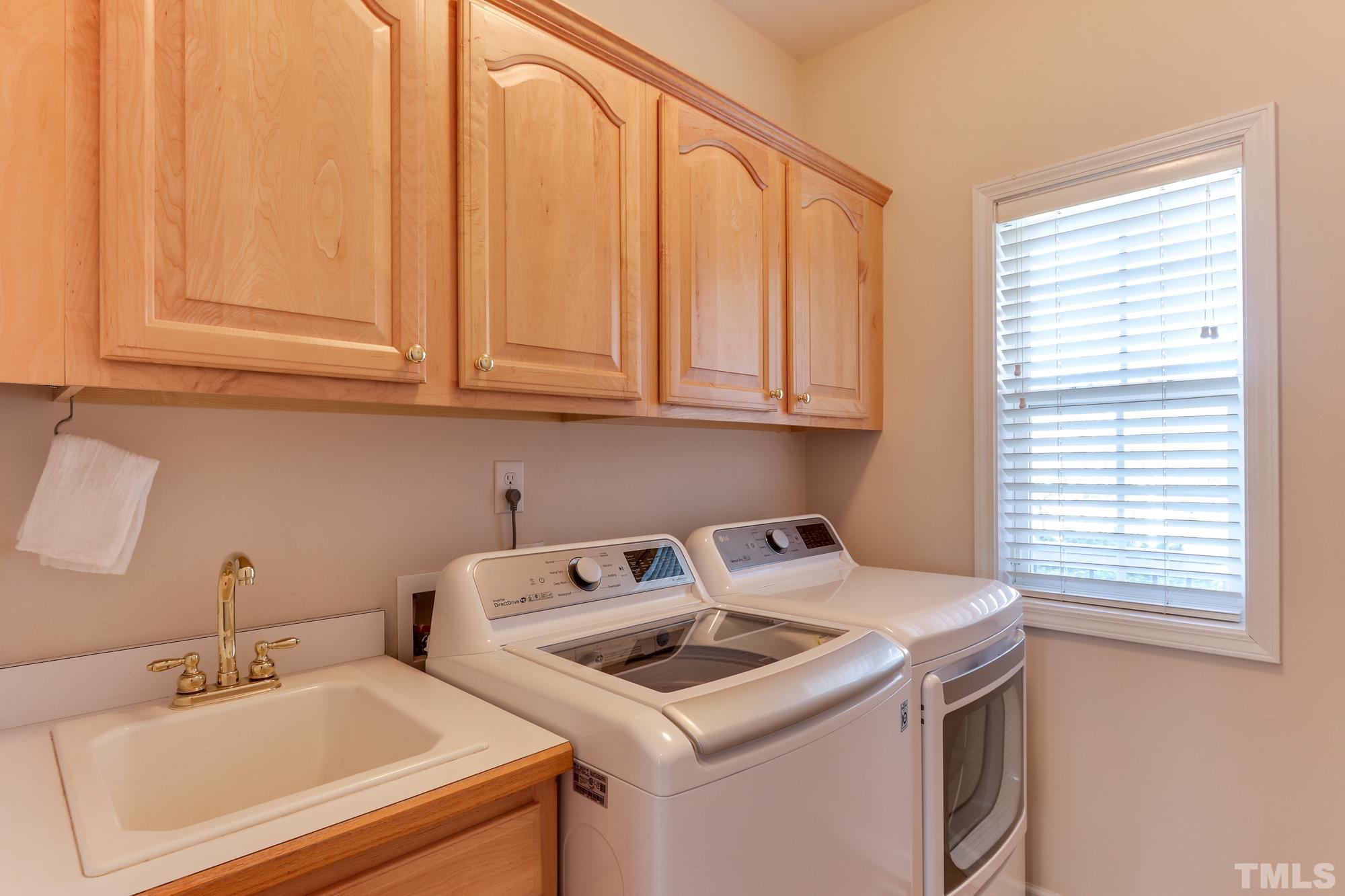 100 Mickleson Ridge Drive Raleigh, NC 27603 - Photo 21 of 59 a utility room with dryer and washer