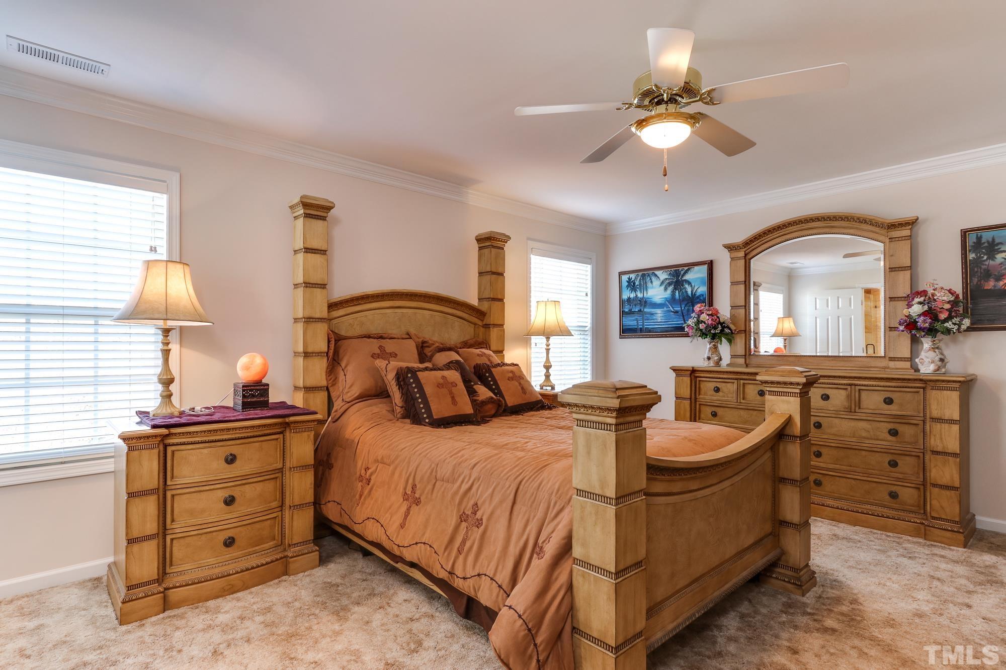 100 Mickleson Ridge Drive Raleigh, NC 27603 - Photo 22 of 59 a bedroom with a bed and a dresser