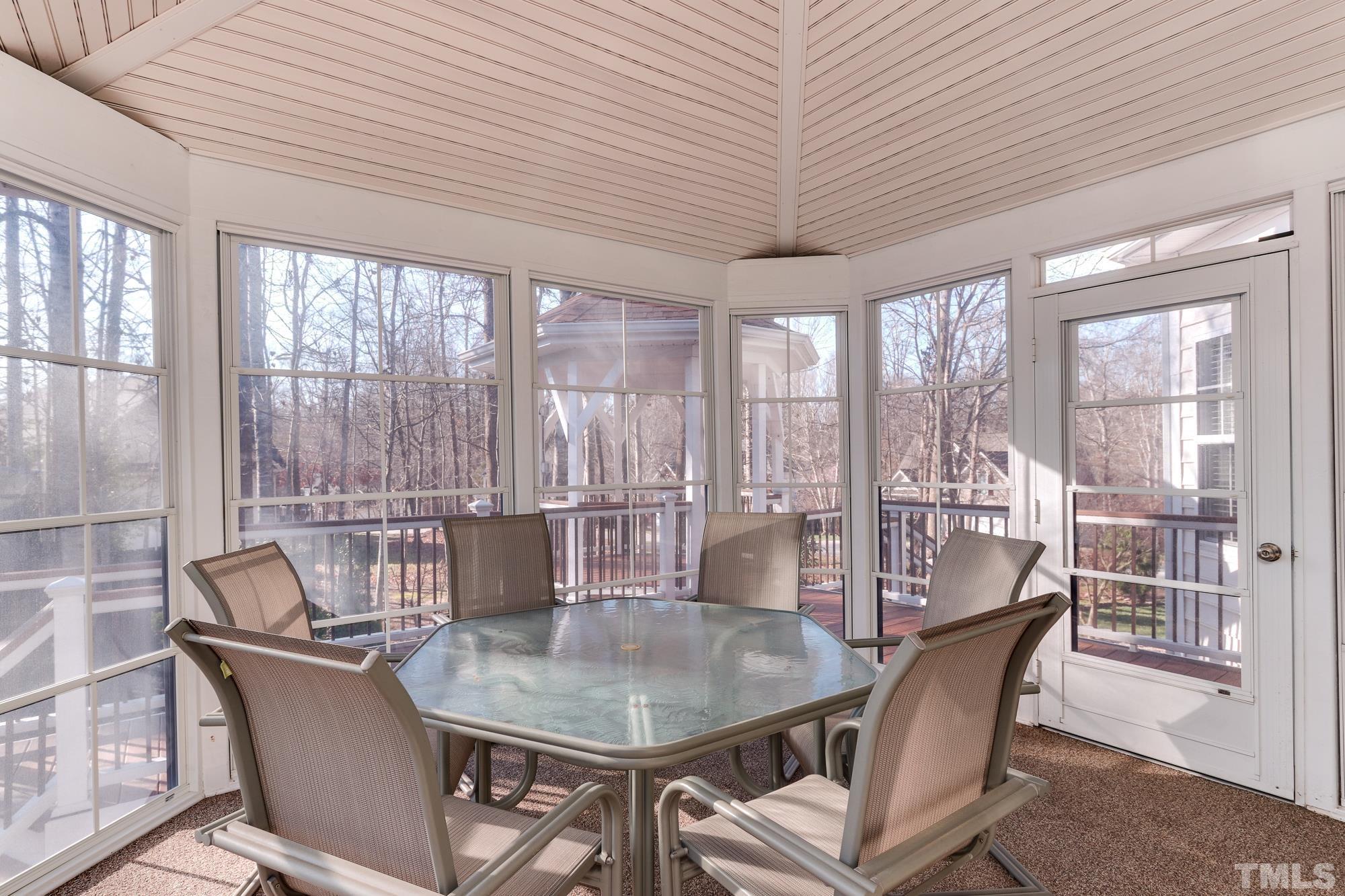 100 Mickleson Ridge Drive Raleigh, NC 27603 - Photo 34 of 59 a dining room with furniture a chandelier and wooden floor