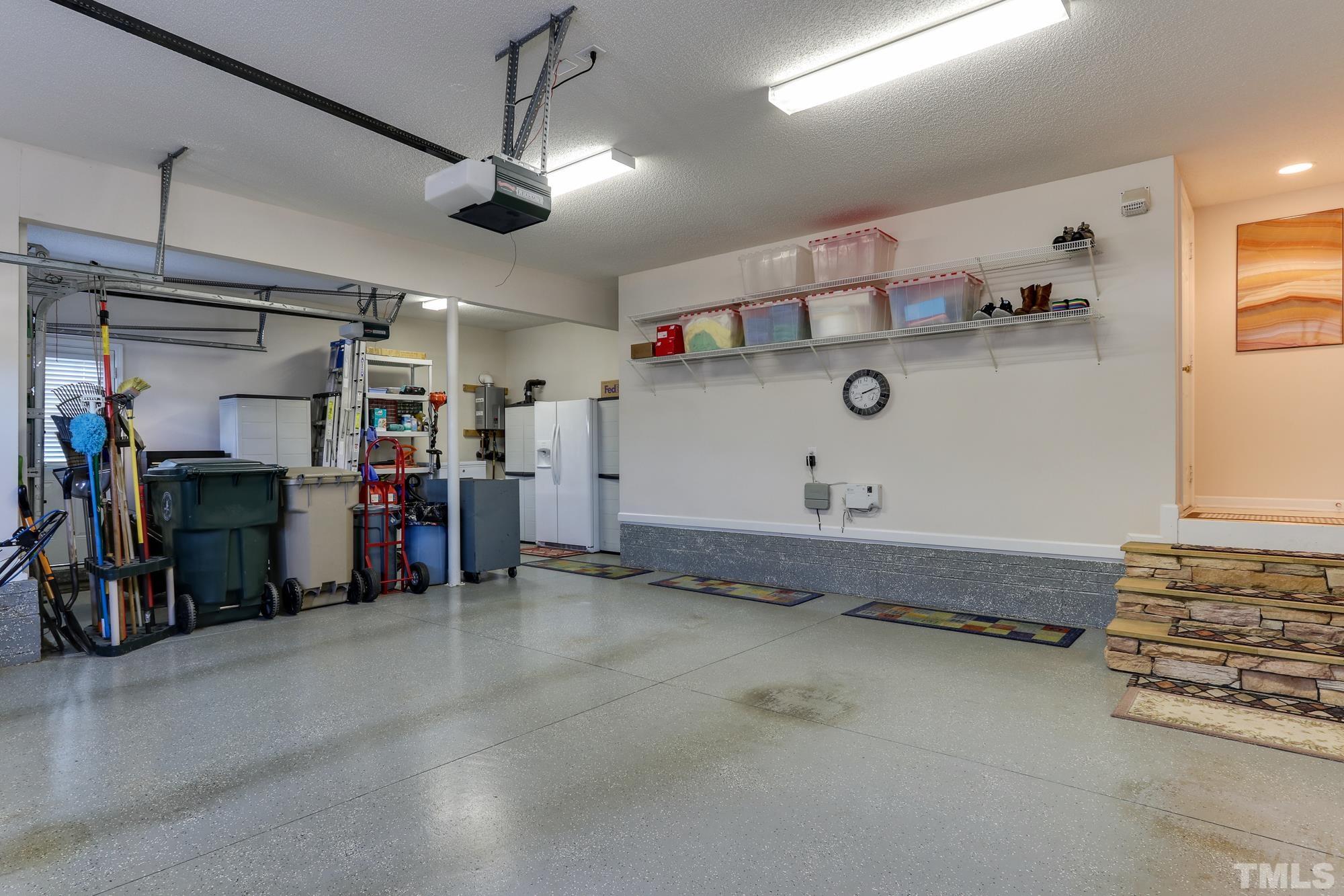 100 Mickleson Ridge Drive Raleigh, NC 27603 - Photo 41 of 59 Epoxy flooring and lots of shelving