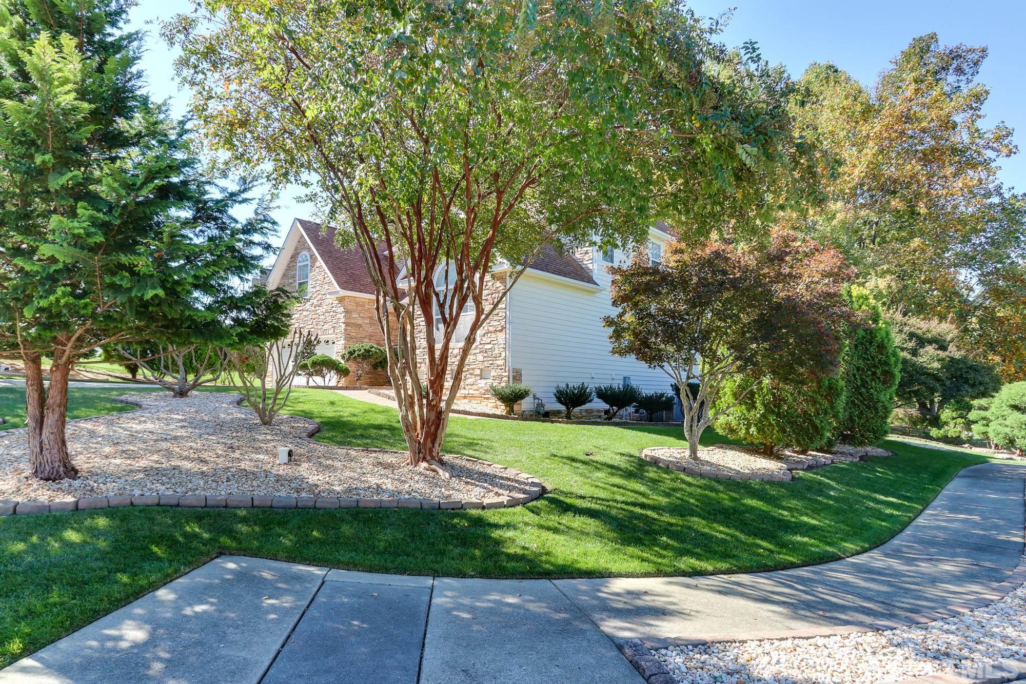 100 Mickleson Ridge Drive Raleigh, NC 27603 - Photo 45 of 59 a view of a yard with plants and large trees