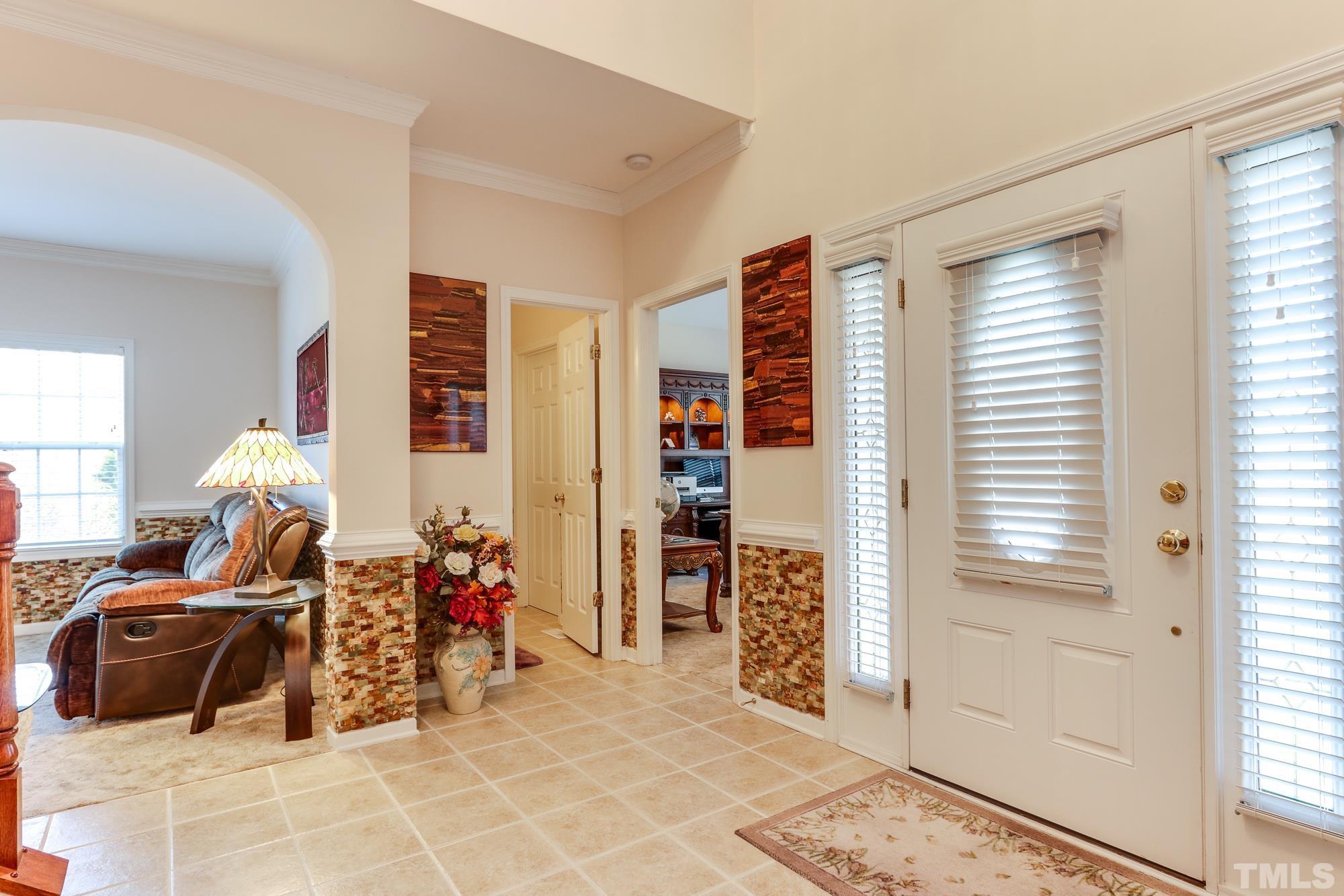 100 Mickleson Ridge Drive Raleigh, NC 27603 - Photo 6 of 59 a view of a livingroom with furniture and windows