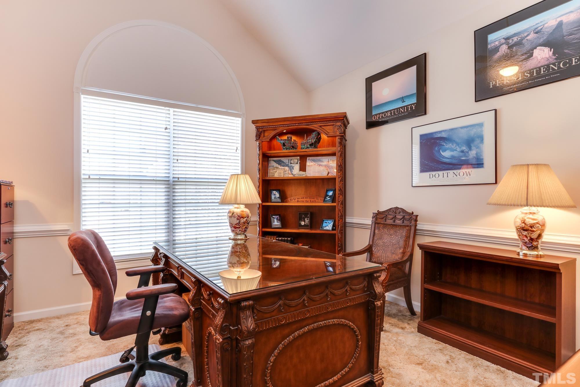100 Mickleson Ridge Drive Raleigh, NC 27603 - Photo 8 of 59 a view of a workspace with furniture and a window