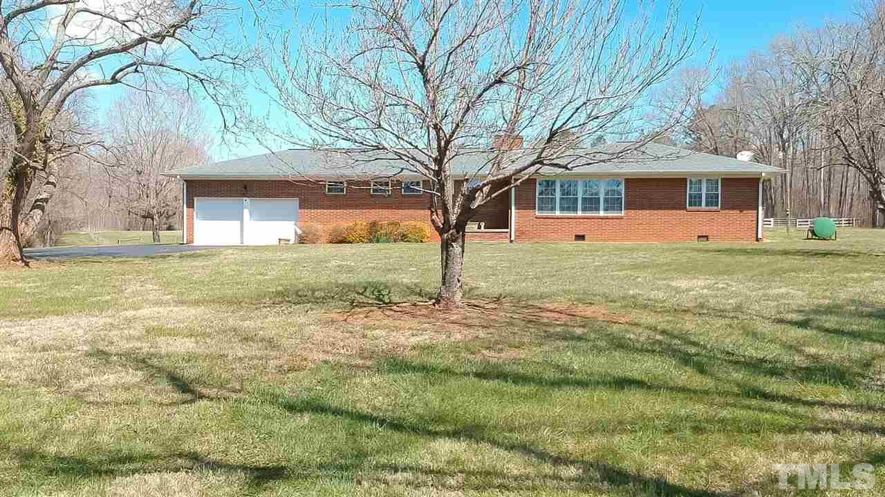 959 Lawson Chapel Church Road Roxboro, NC 27574 - Photo 2 of 25 a front view of a house with a yard