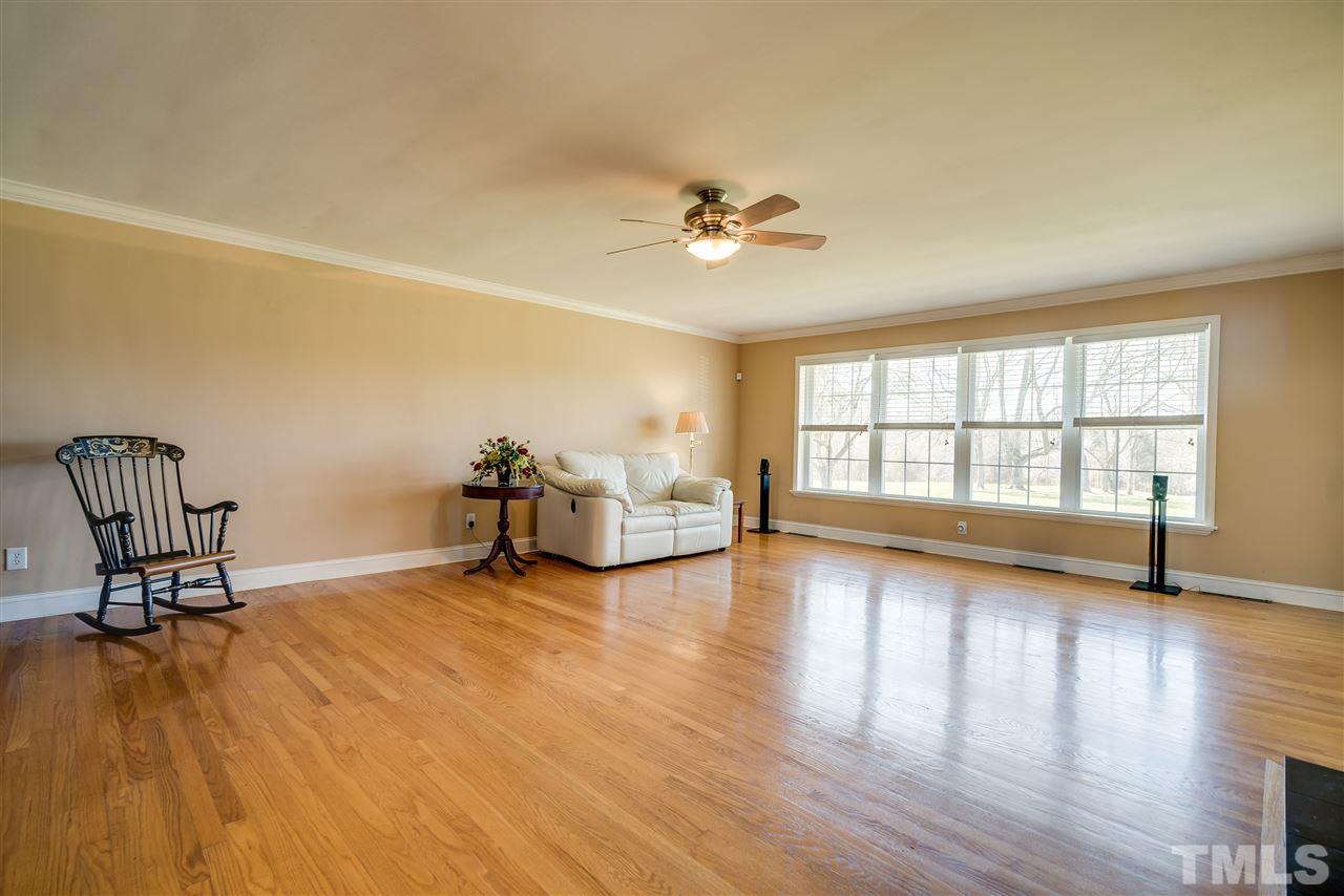 959 Lawson Chapel Church Road Roxboro, NC 27574 - Photo 6 of 25 a view of a room with wooden floor and a window