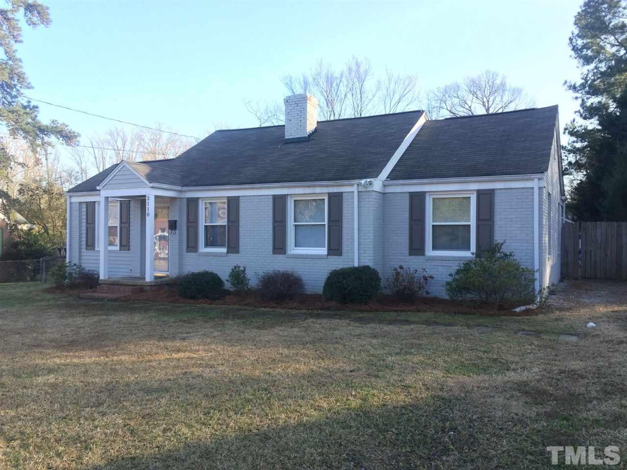 2110 Tudor Place Raleigh, NC 27610 - Photo 2 of 17 a front view of a house with a garden