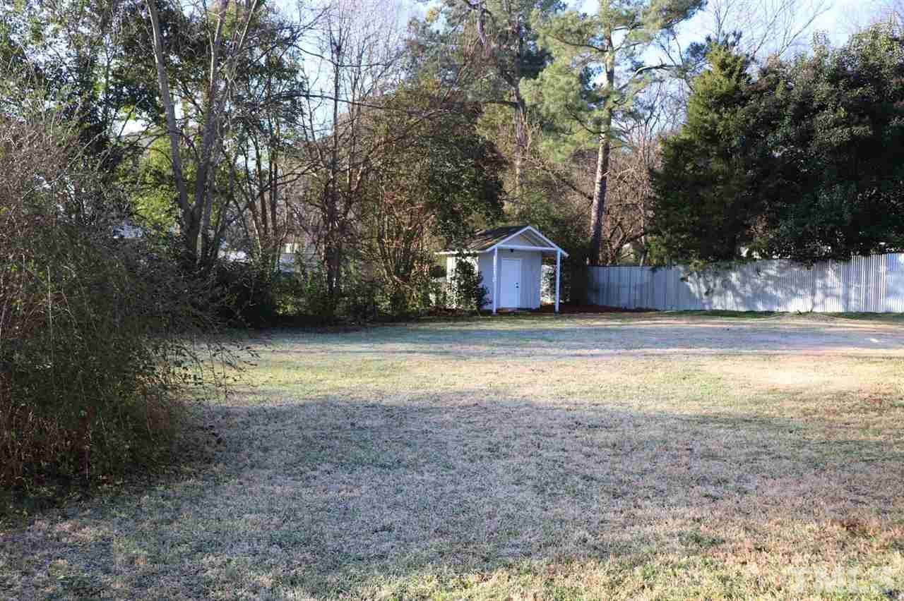 2110 Tudor Place Raleigh, NC 27610 - Photo 16 of 17 a view of a house with a yard