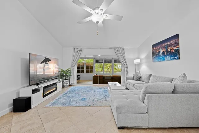 a living room with fireplace furniture and a flat screen tv