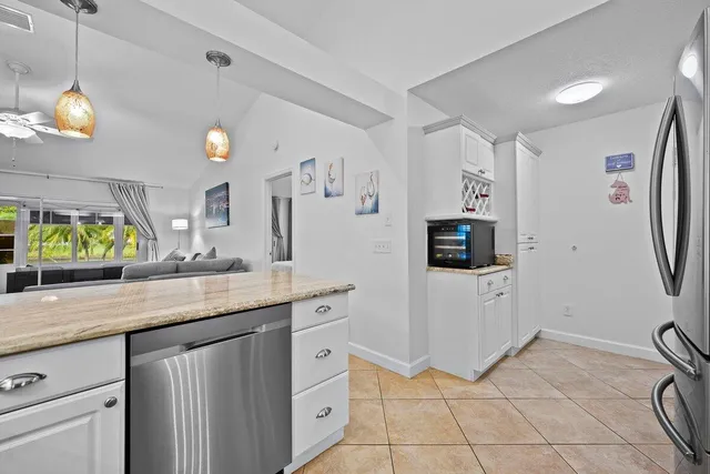 a kitchen with a sink cabinets and window