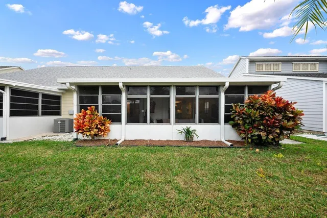 a front view of a house with garden and porch
