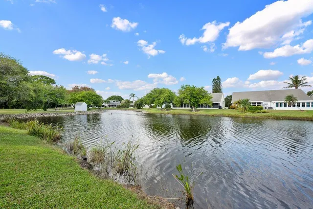 a view of a lake with houses in the background