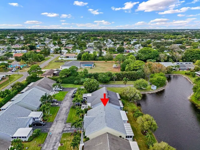an aerial view of residential houses with outdoor space and street view