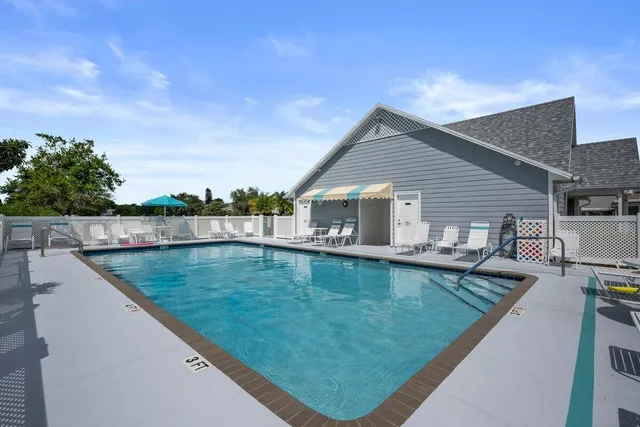 a view of a house with swimming pool